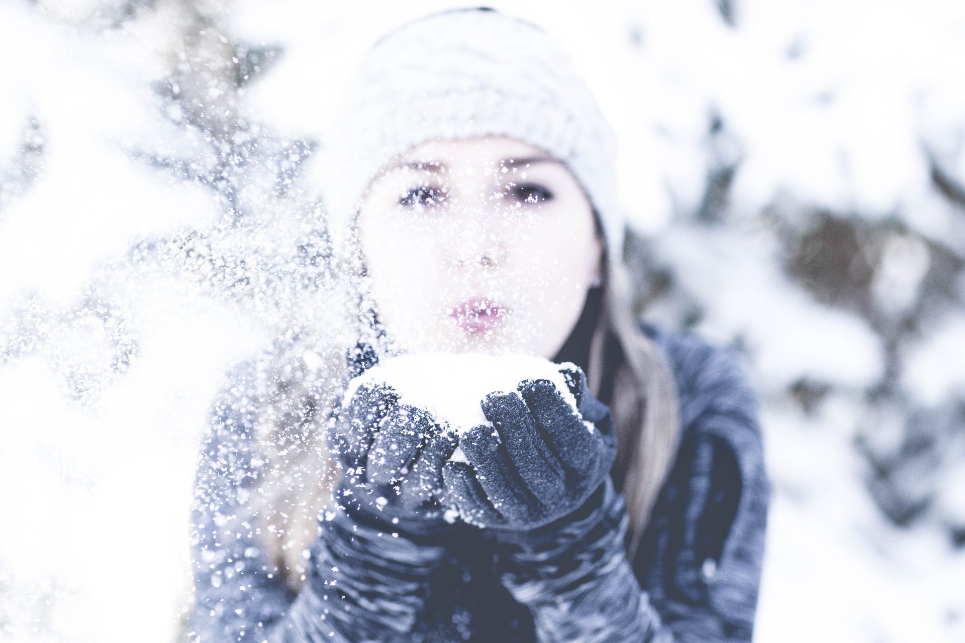 girl-blowing-snow